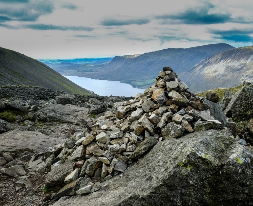 Just a small cairn on the path up to the summit of Scafell Pike in the Lake District, Wast Water in the background.